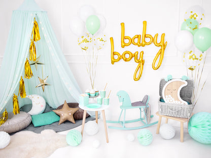 BABY SHOWER SET UP WITH A GOLD TASSEL GARLAND HANGING ON A CANOPY 