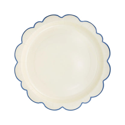 white paper plate with scalloped edge and blue border