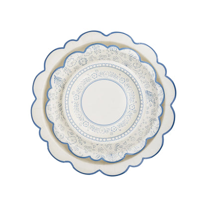 Set of two paper plates with blue scalloped edges; top plate features a blue floral pattern design.