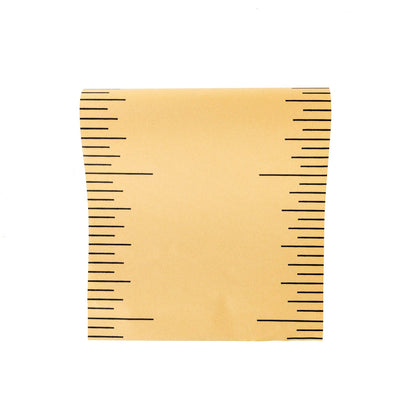 brown table runner with black measurement markings depicting a ruler design