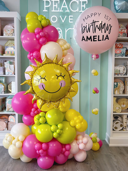 first birthday bright colourful balloon garland and personalized helium bundle. 