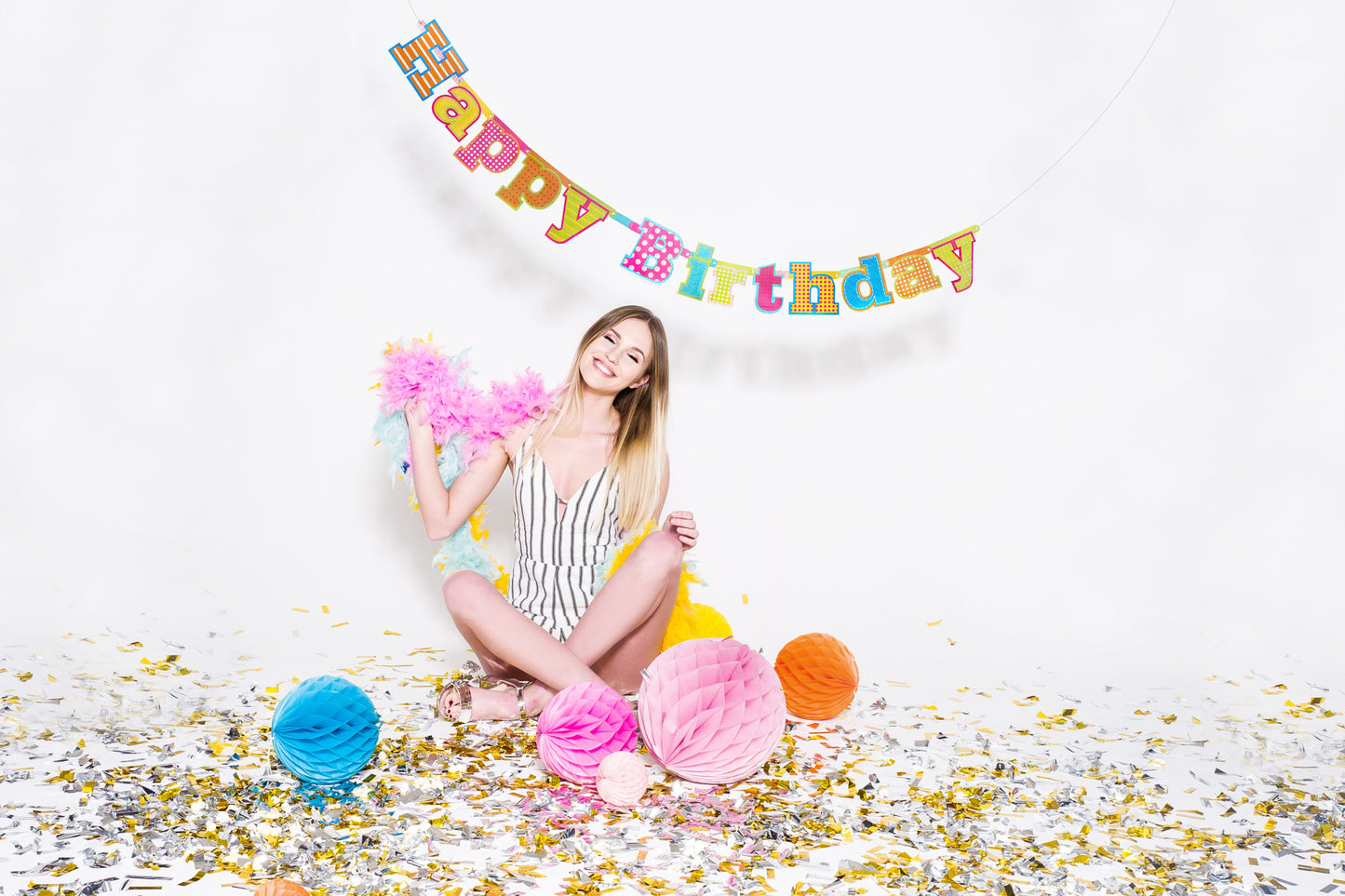 birthday photoshoot with confetti and honeycombs