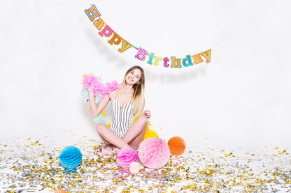 birthday photoshoot with confetti and honeycombs