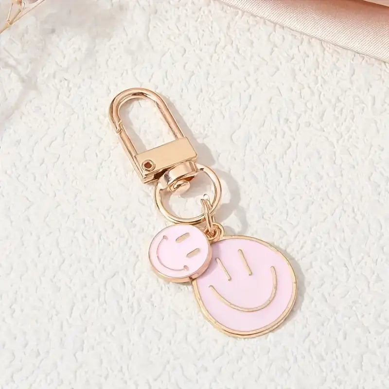 mini double happy face keychain in light pink