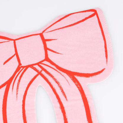 bow shaped paper napkins close up in pink and red 