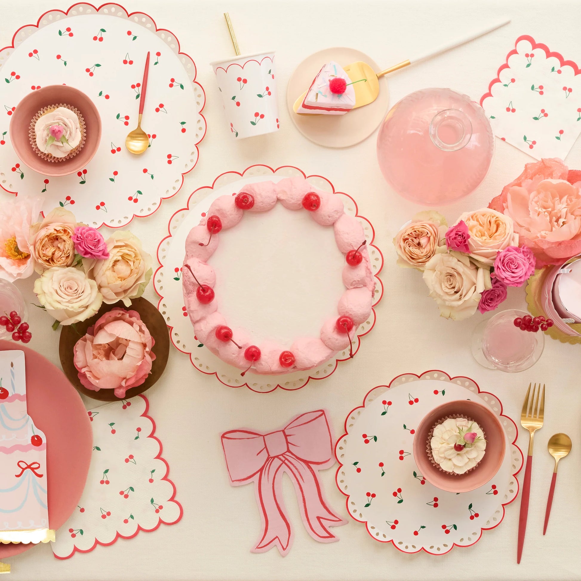 bow shaped paper napkins paired with cherry party supplies and flowers 