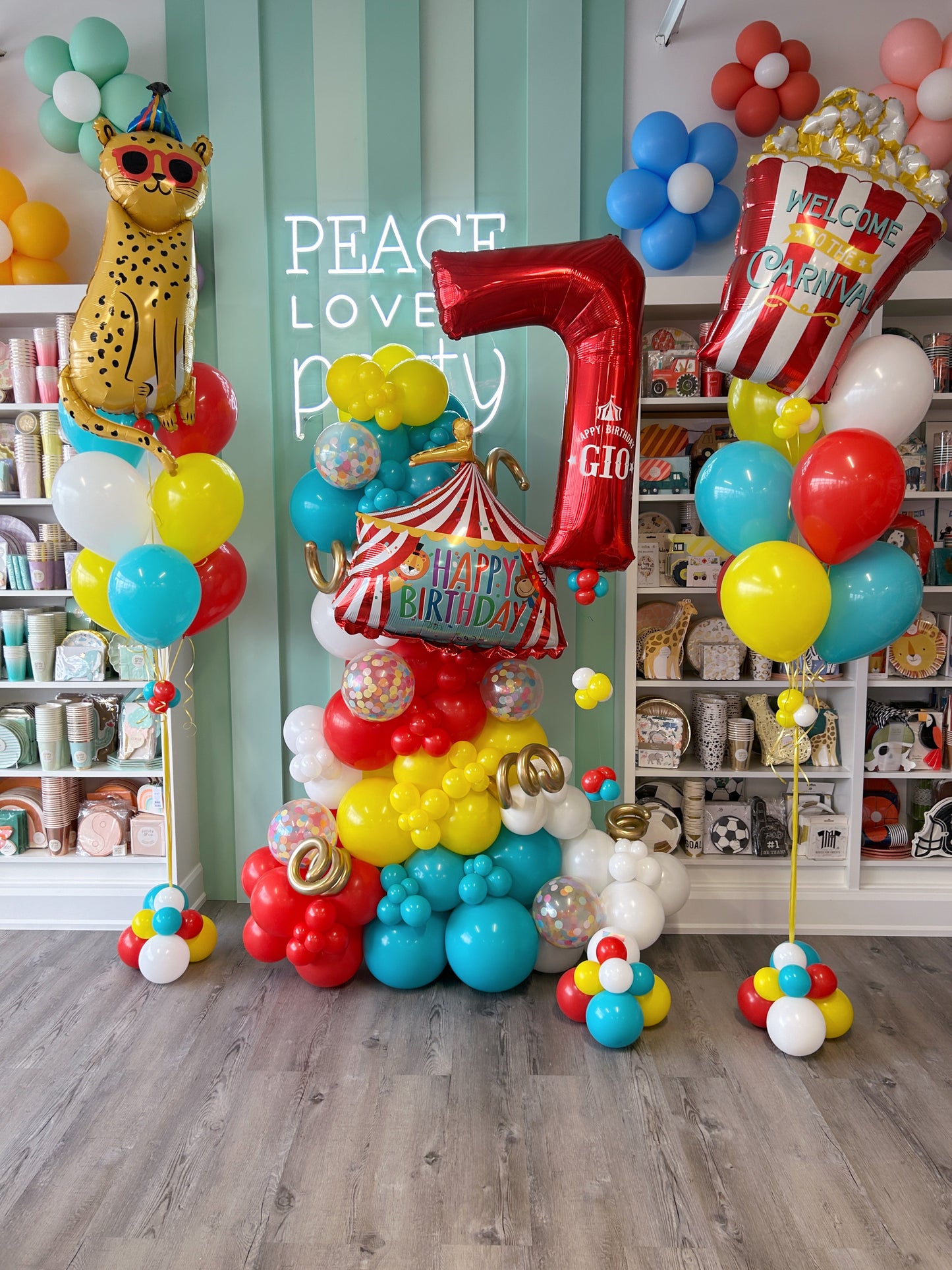 carnival birthday balloon garland + helium balloon bundles. featuring popcorn, party animal cheetah, happy birthday circus tent + personalized foil number