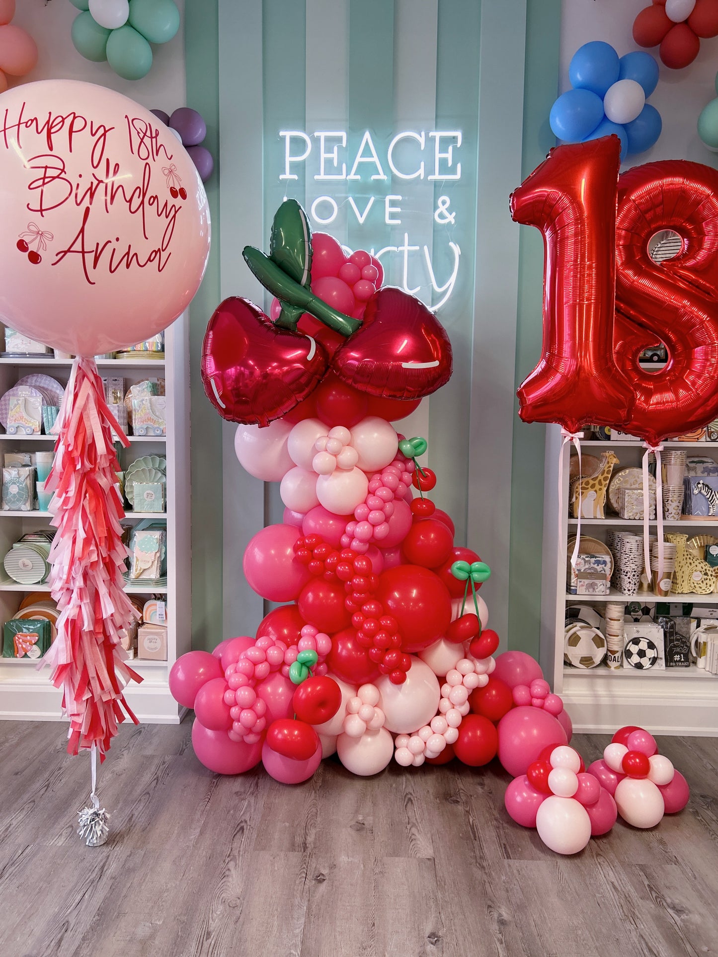 free standing cherry balloon garland with personalized helium jumbo balloon and a set of number 