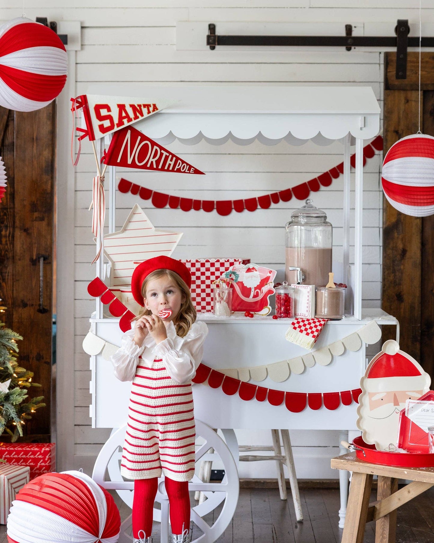 Christmas holiday party supplies displayed on a sweet cart 