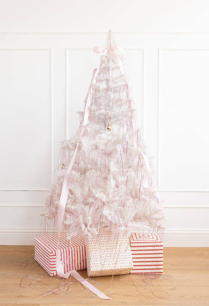 white christmas tree with pink tinsel 