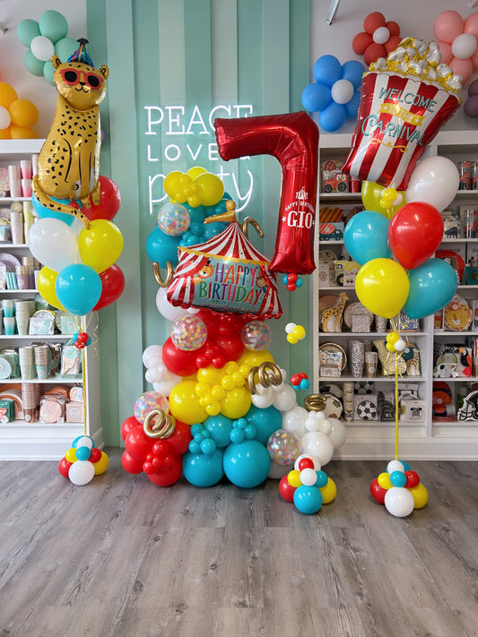 circus themed balloon garland and helium bundles 