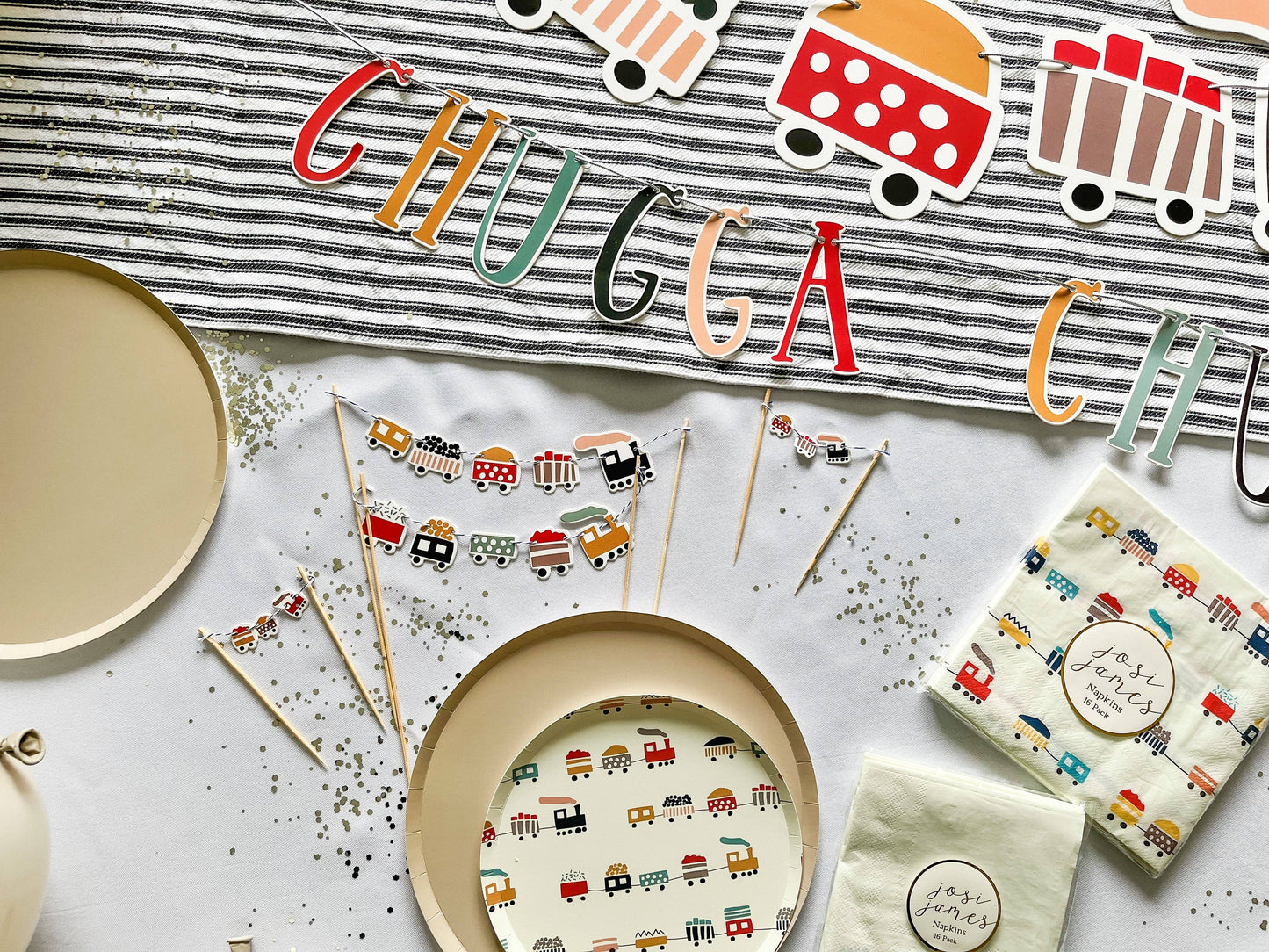 beige paper plate paired with train themed party supplies by Josi James 