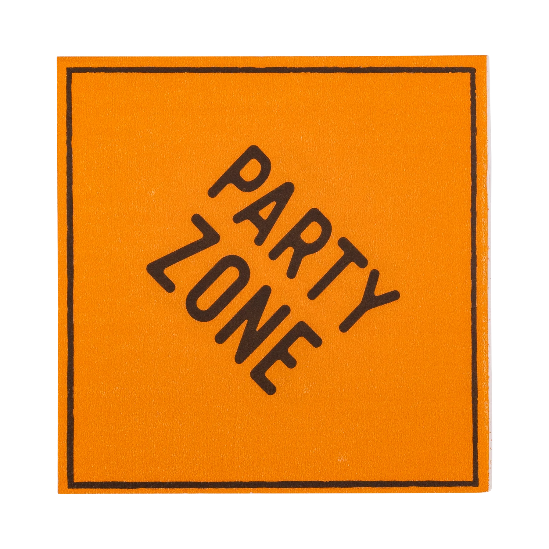 Orange square napkin resembling a construction sign with 'paper zone' message in black.