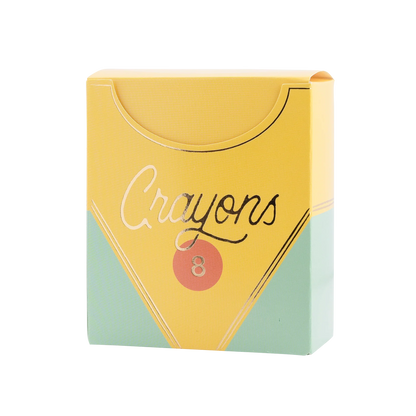 yellow treat box made to resemble a crayon box with gold accents and 'crayons' in gold stylized text