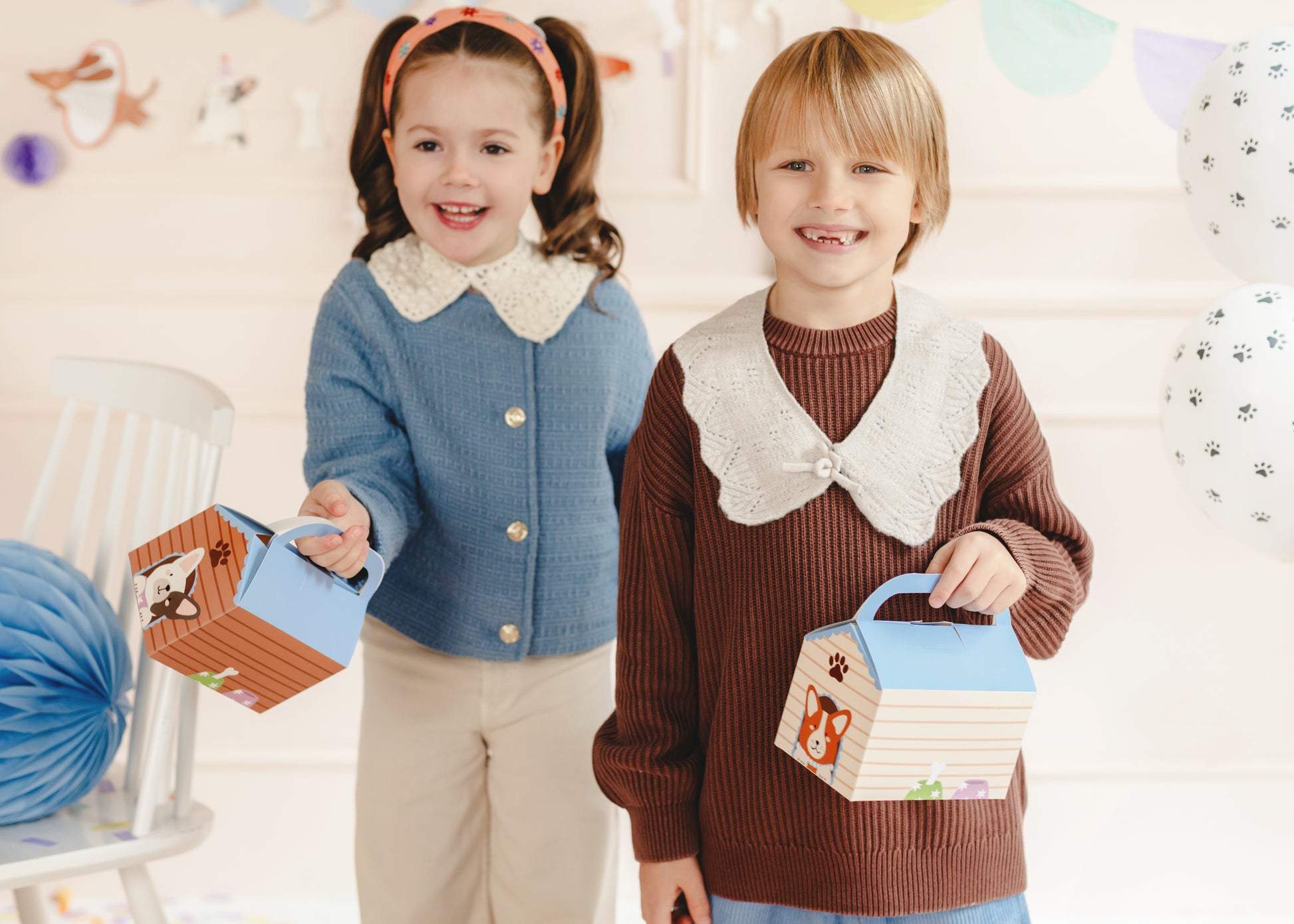 puppy party doghouse favour boxes with kids holding them 