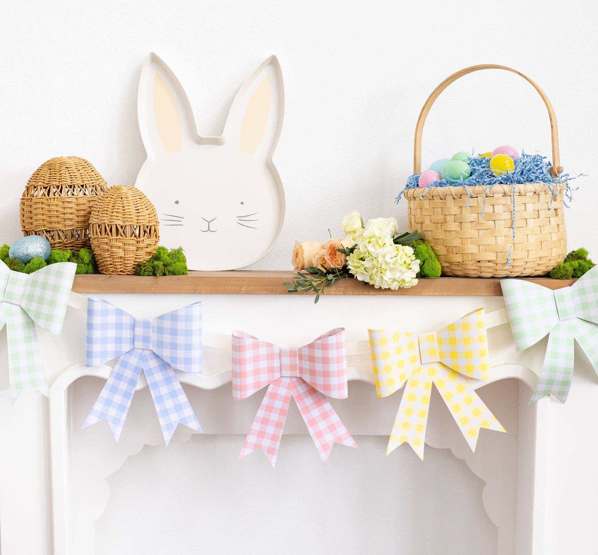 easter setup on fireplace mantle with pastel gingham bow banner and easter decor
