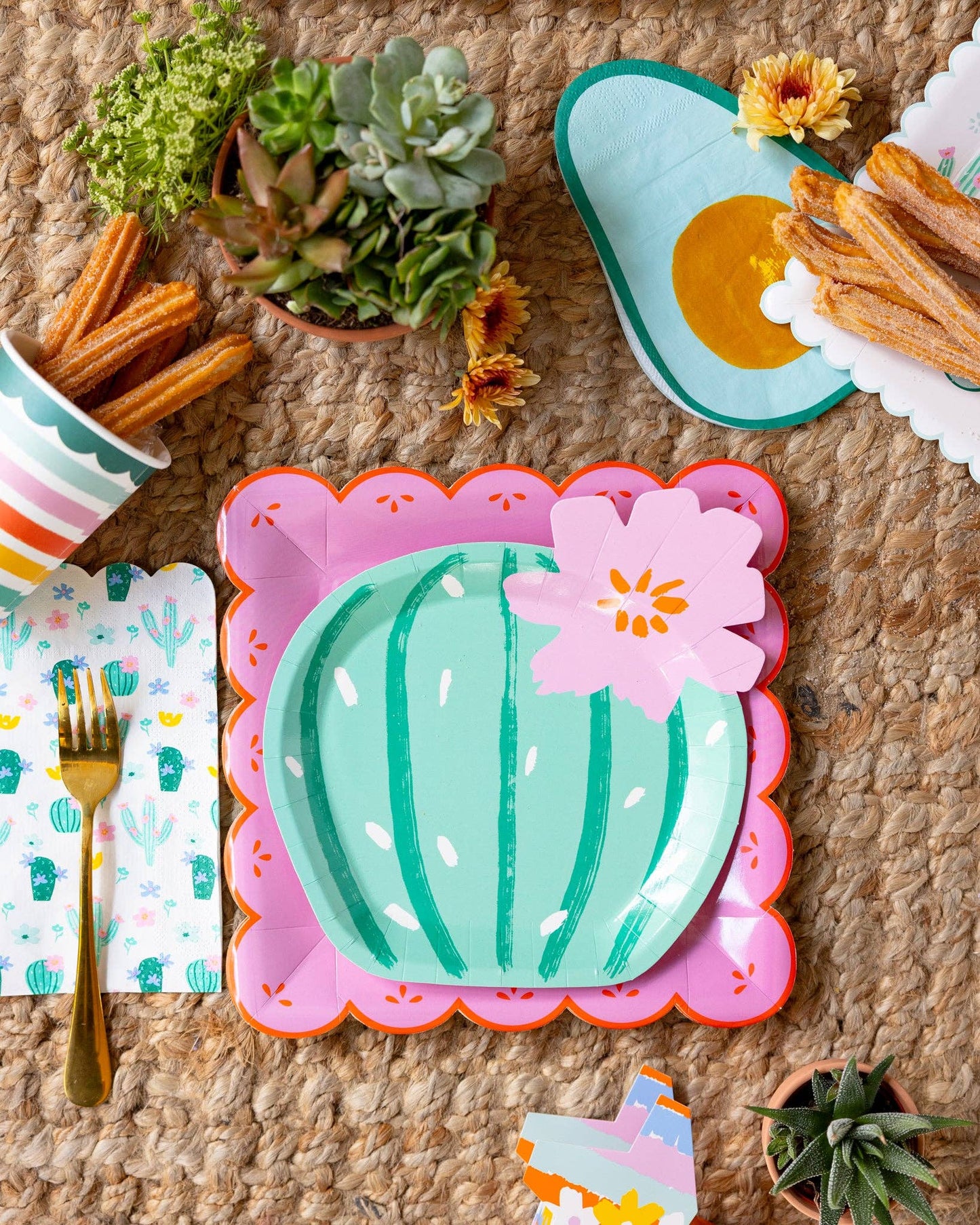 fiesta party supplies - chargers, cactus plate, avocado napkin and stripe paper cups 