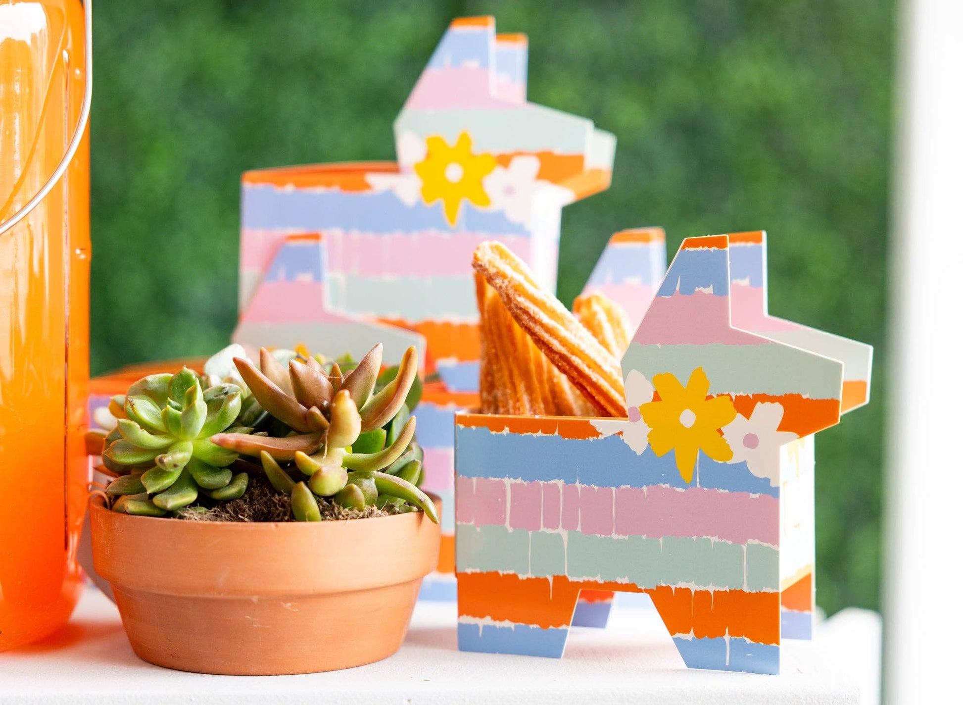 fiesta piñata treat boxes with churros displayed