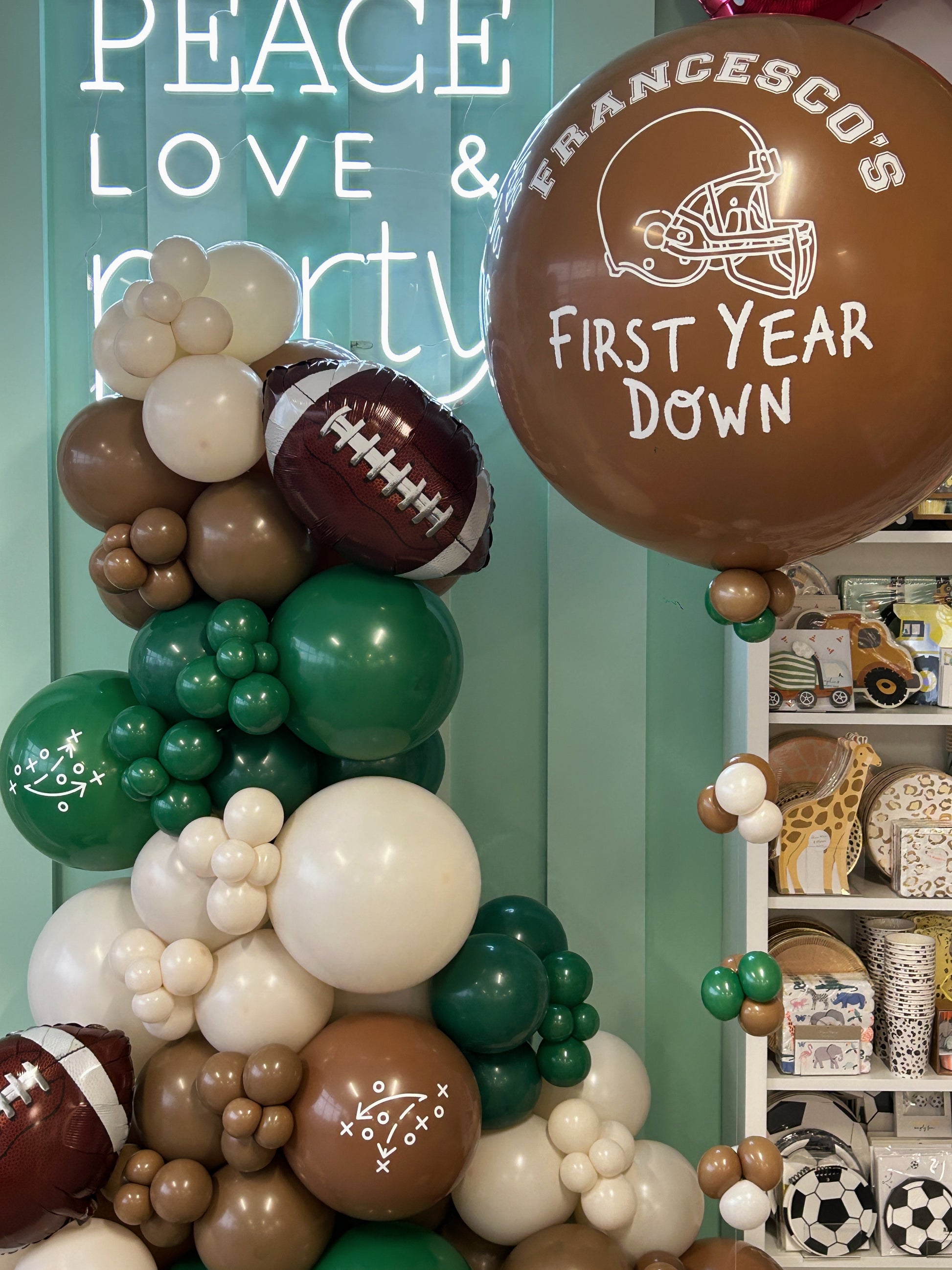 football garland with football foil balloons and personalized helium balloon bundle