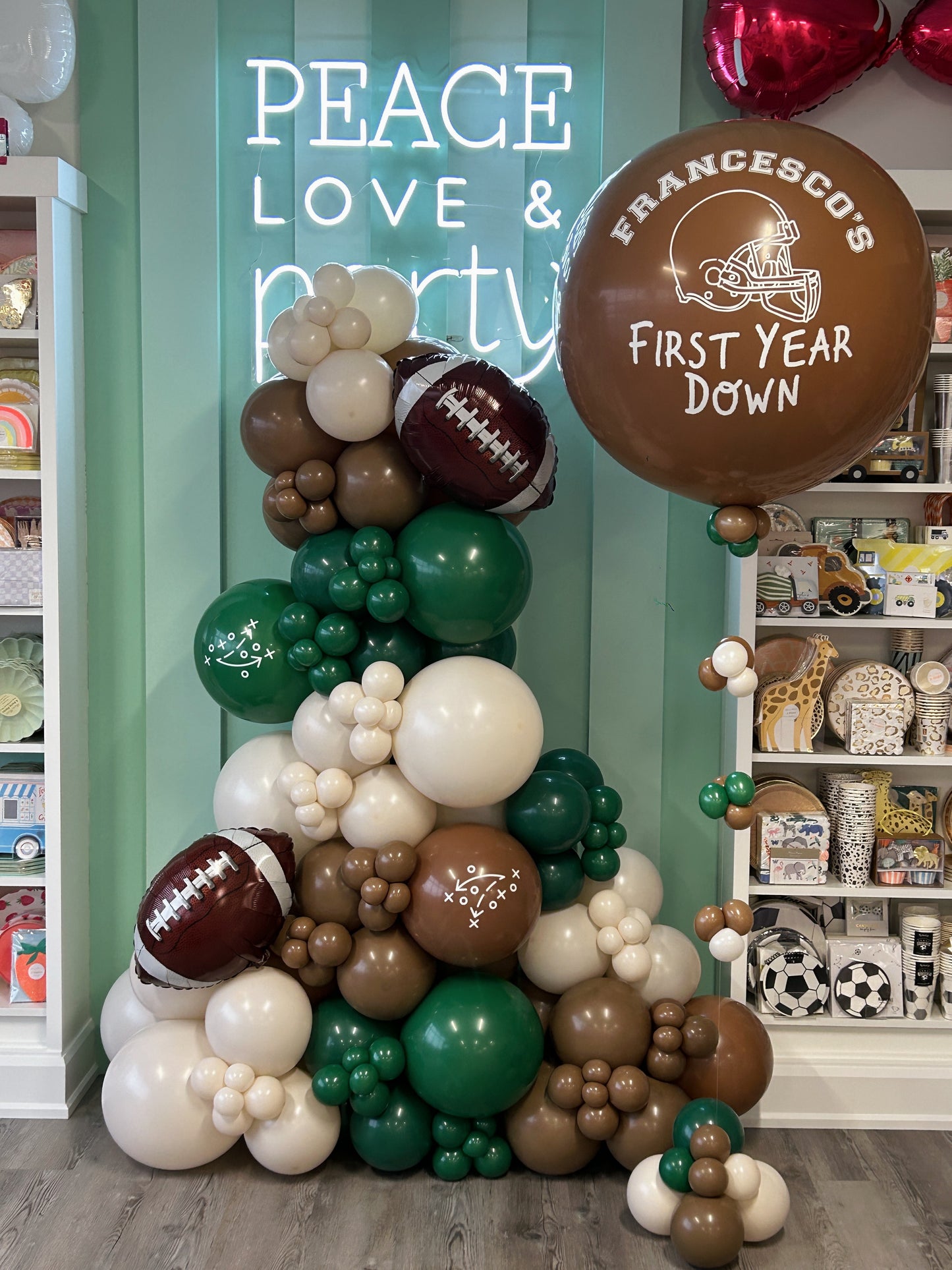 football free standing balloon garland and jumbo personalized helium balloon with a balloon tassel