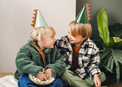 two friends wearing dino hats