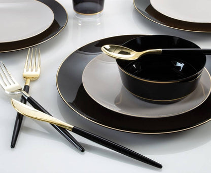 table setting with black and gold plastic dinner ware