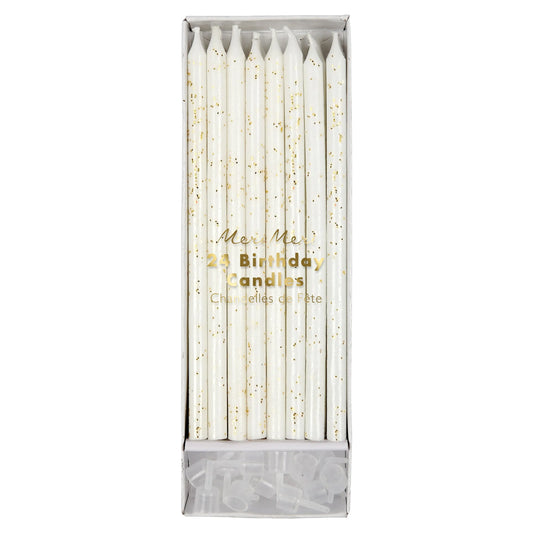 package of white candles with gold glitter detail