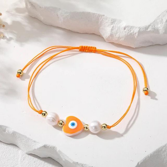 gold plated evil eye rope bracelet - orange