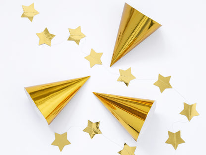 gold party hats with gold star foil banner