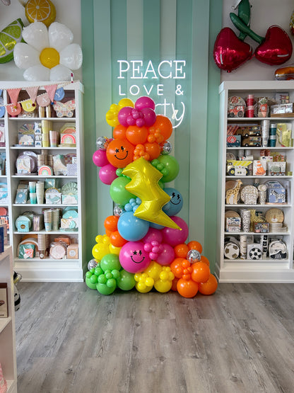 colourful good vibes only balloon garland- featuring disco balls, happy face logos and lightning bolt foil balloon