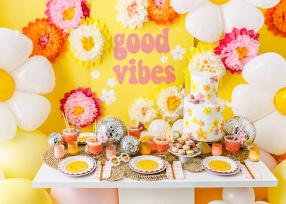 good vibes birthday decor with daisies, disco balls and sunglasses