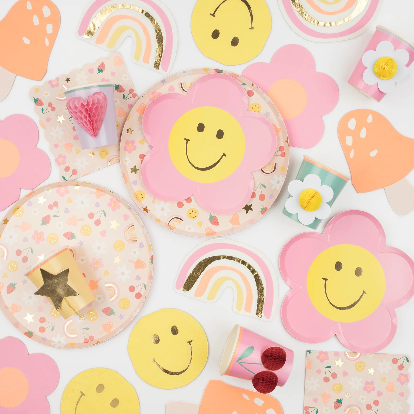 90s inspired party supplies featuring nostalgic icons like smiley faces, mushrooms, cherries and more