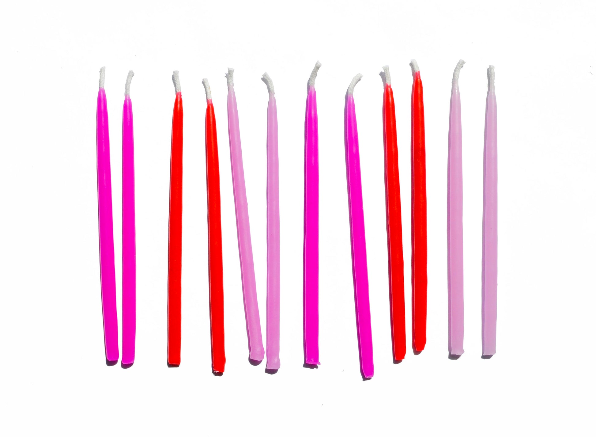 different shades of pink hand dipped candles 