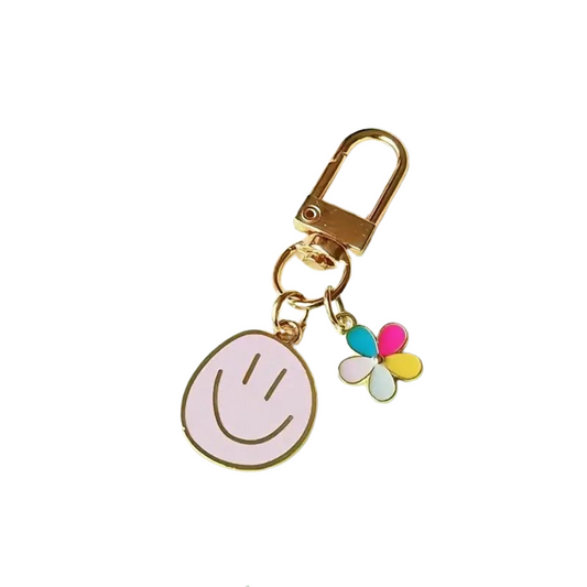 happy face with mini colourful flower keychain with a gold clip