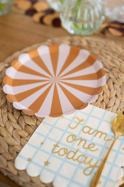 'i am one today' napkin with brown and pink striped dessert plate with matching gold fork 