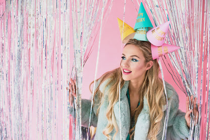 lady modelling large party hats 