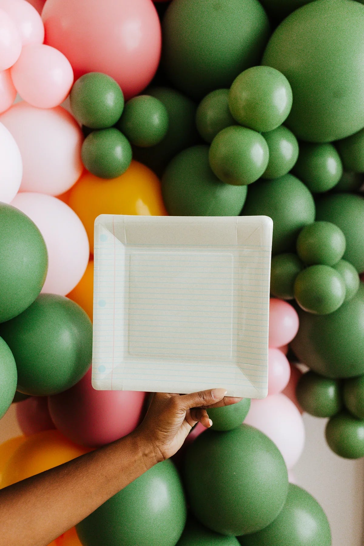 notebook plate in front of balloon display