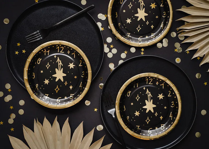 black and gold clock plates new years 2024