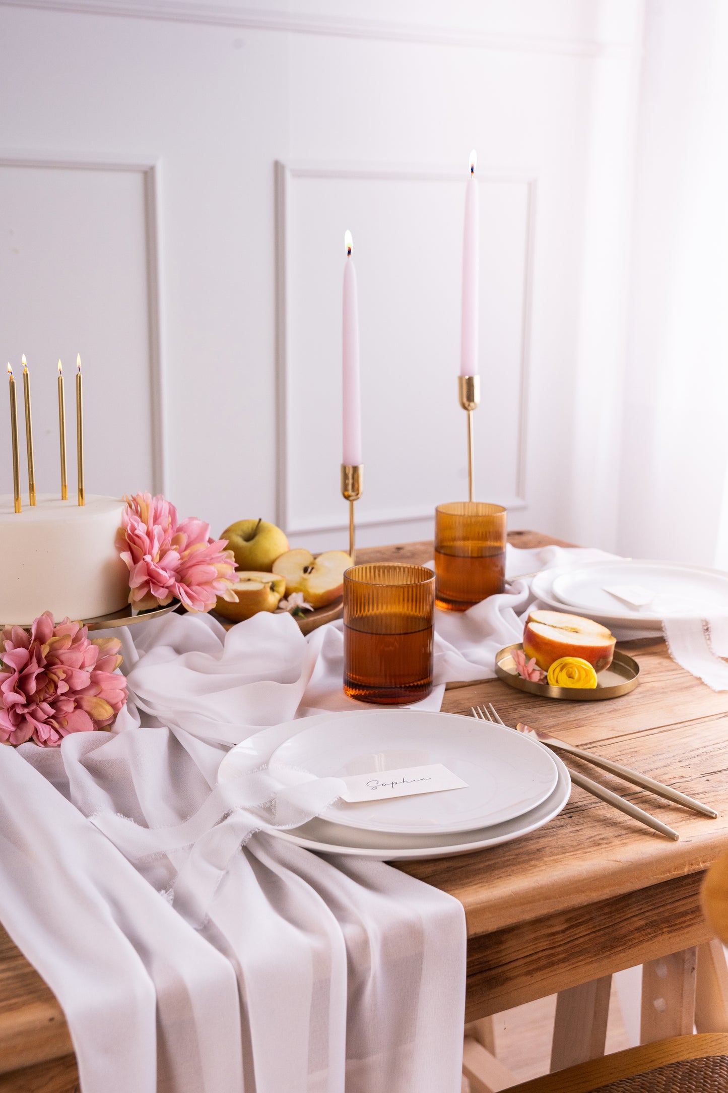 off white chiffon table runner with matching decor, cake and candles 