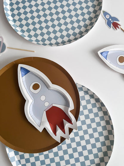 large blue checkered paper plate paired with a spaceship paper plate 