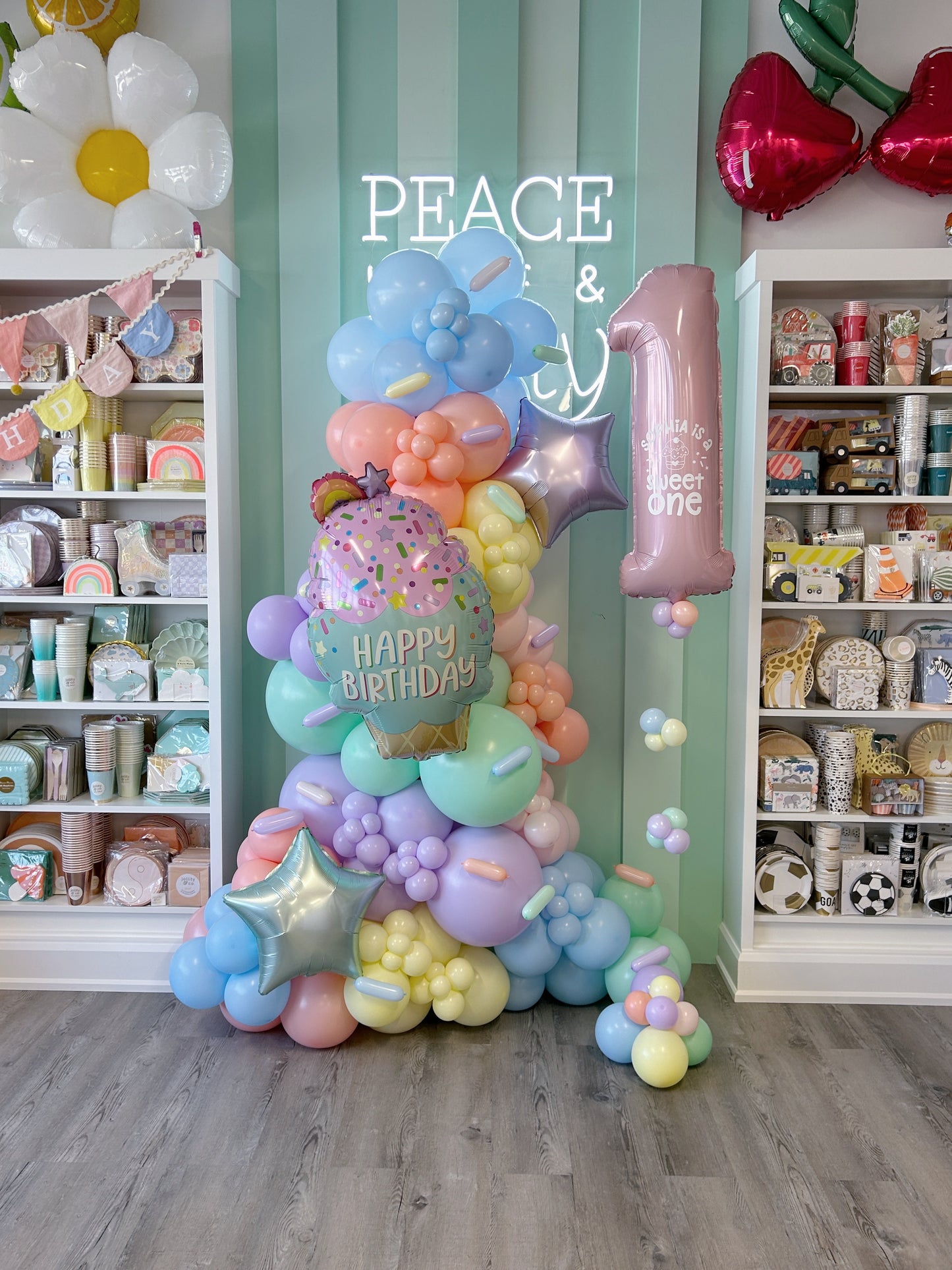 pastel first birthday freestanding balloon garland 