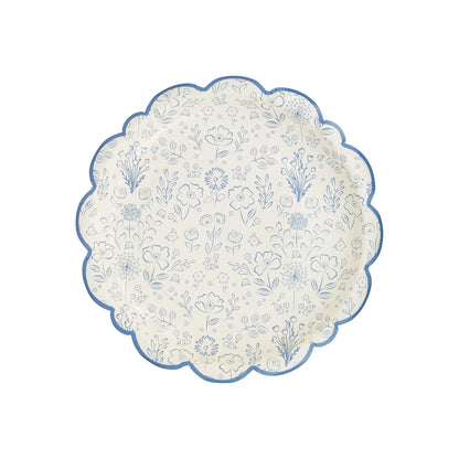 scalloped edge cream plates with blue bordered edge and blue floral design