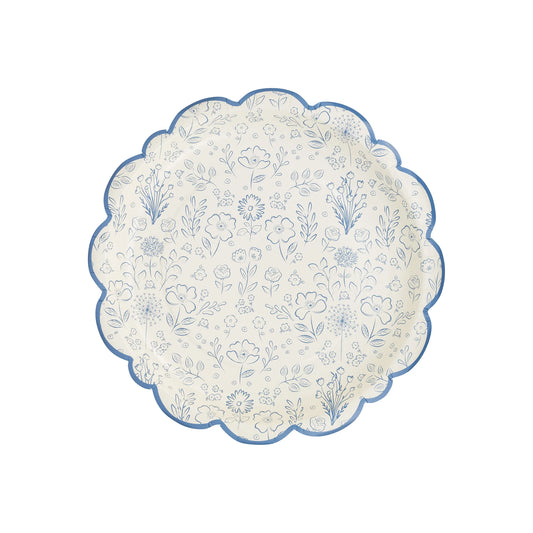 scalloped edge cream plates with blue bordered edge and blue floral design