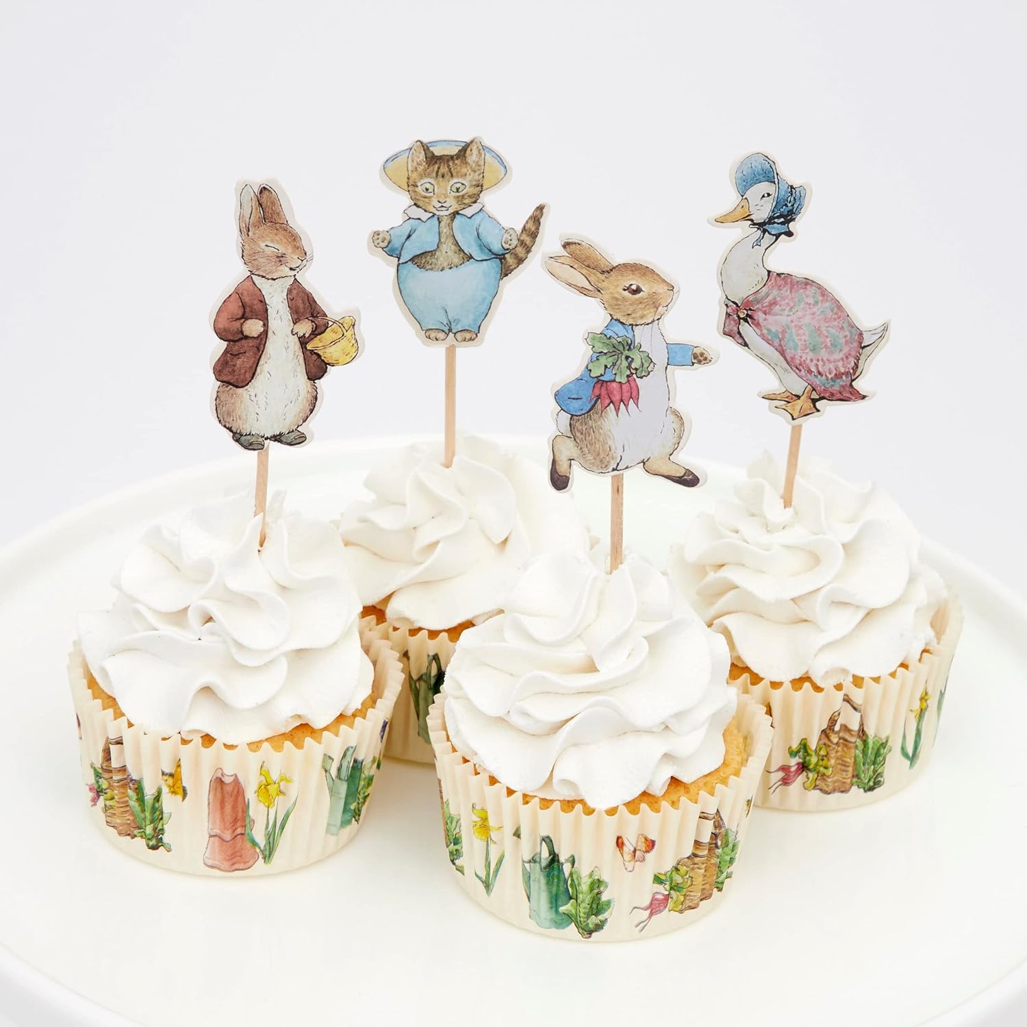 peter rabbit cupcake toppers on freshly baked cupcakes 