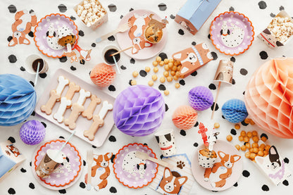 puppy party table scape with matching plates, napkins, snack boxes and cutlery 