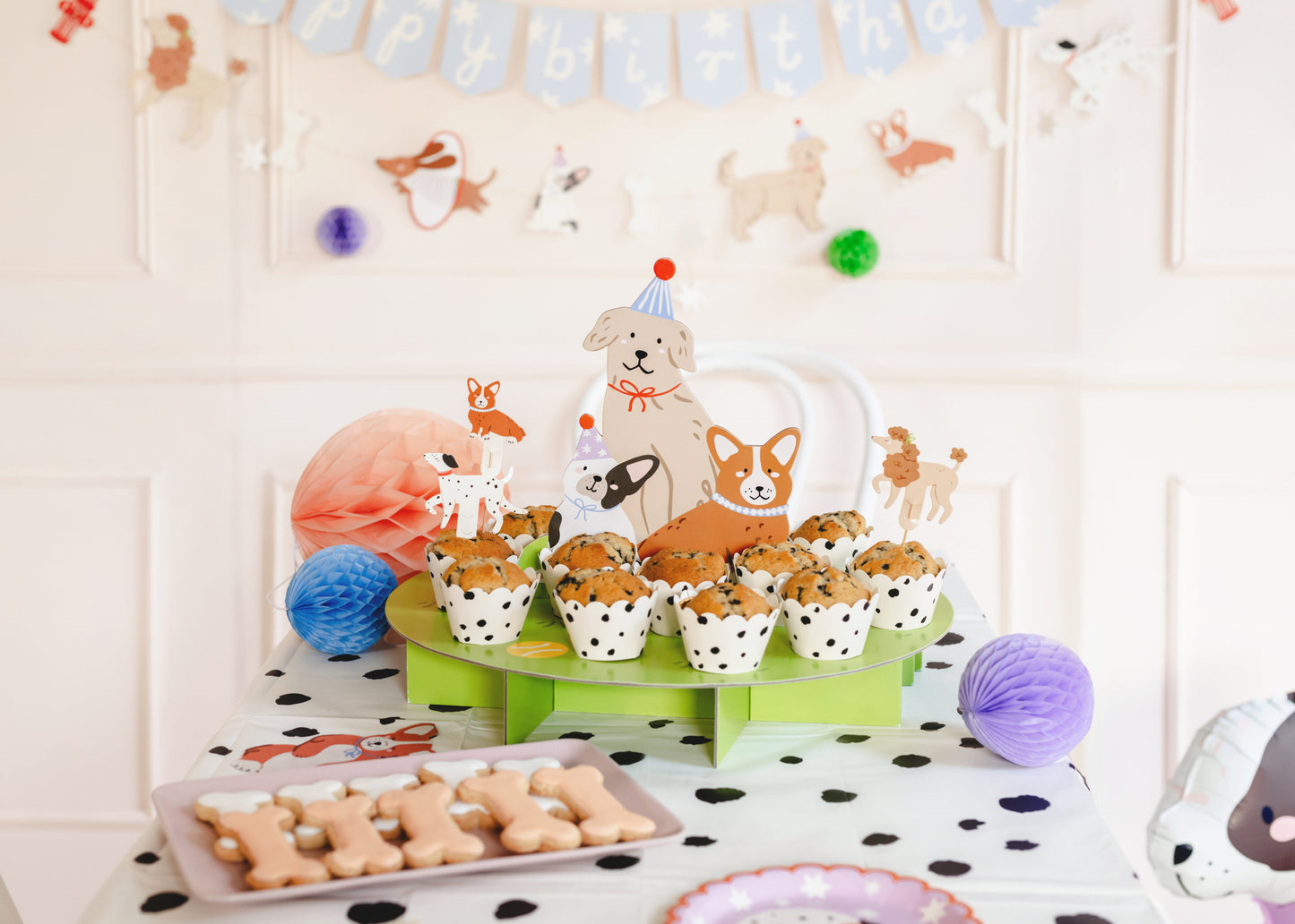 puppy party snack stand with muffin and dog cookies 