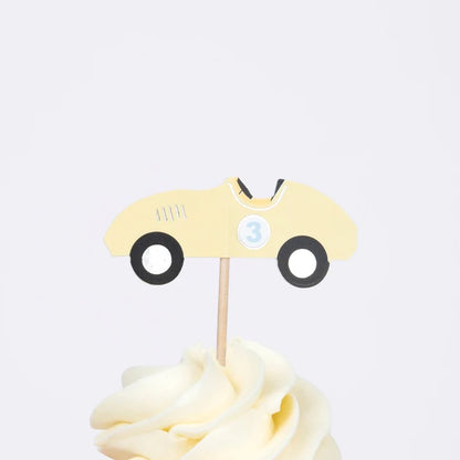 yellow race cars cake topper on a cupcake - by meri meri 