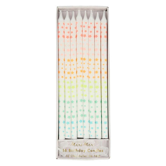 Box of 16 white birthday candles with rainbow stars.