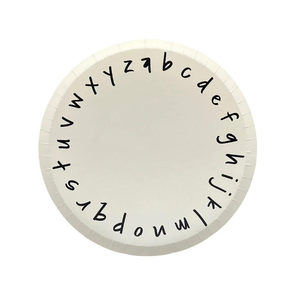 white dessert plate with black lowercase alphabet letters around edge