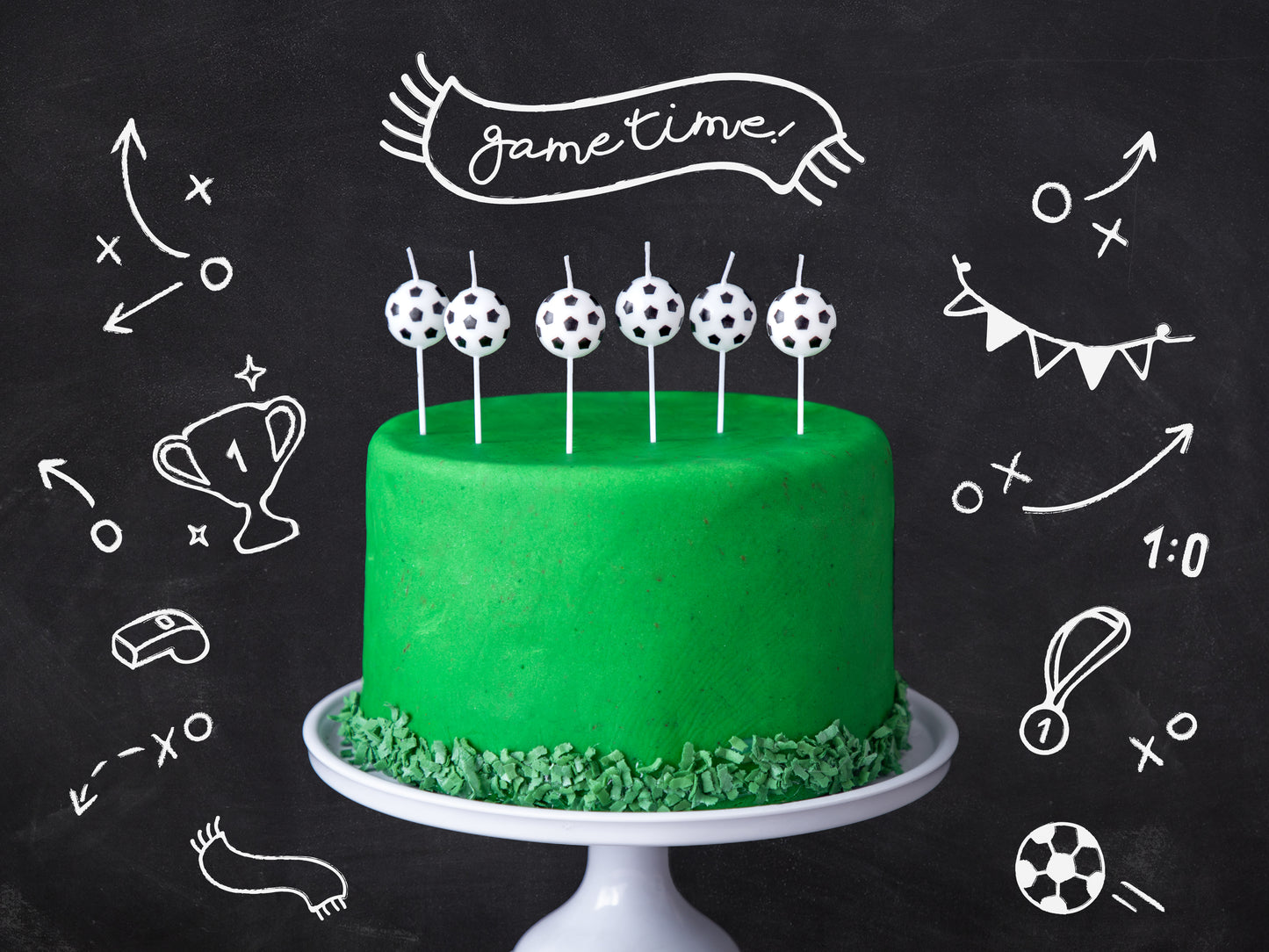 soccer ball candles setup on cake